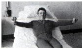pulling the exercise stretcher between hands over chest