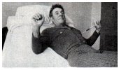 exercise stretcher behind the back hands holding the ends extend  straight up 