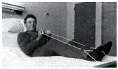 exercise stretcher around feet pulled back by the hands arms brought up to chest