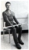 holding the weighted cane with palms up