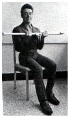 holding the weighted cane with palms up lifitng to the chest