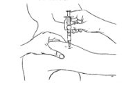 needle inserted in fleshy part of upper arm