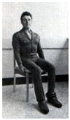sitting on chair with weight around an ankle