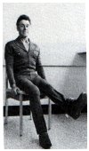 sitting on chair with weight around an ankle lifting the leg
