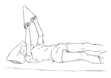 person lying down grasping a trapeze